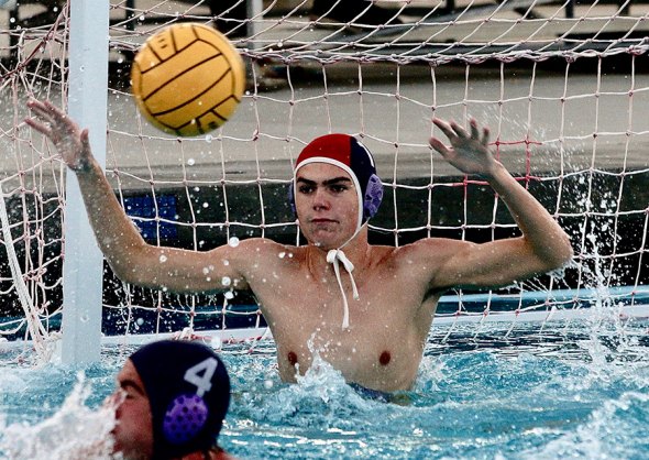 Lemoore's Coen Vannote blocks a shot on goal against Atascadero player in CIF tilt.